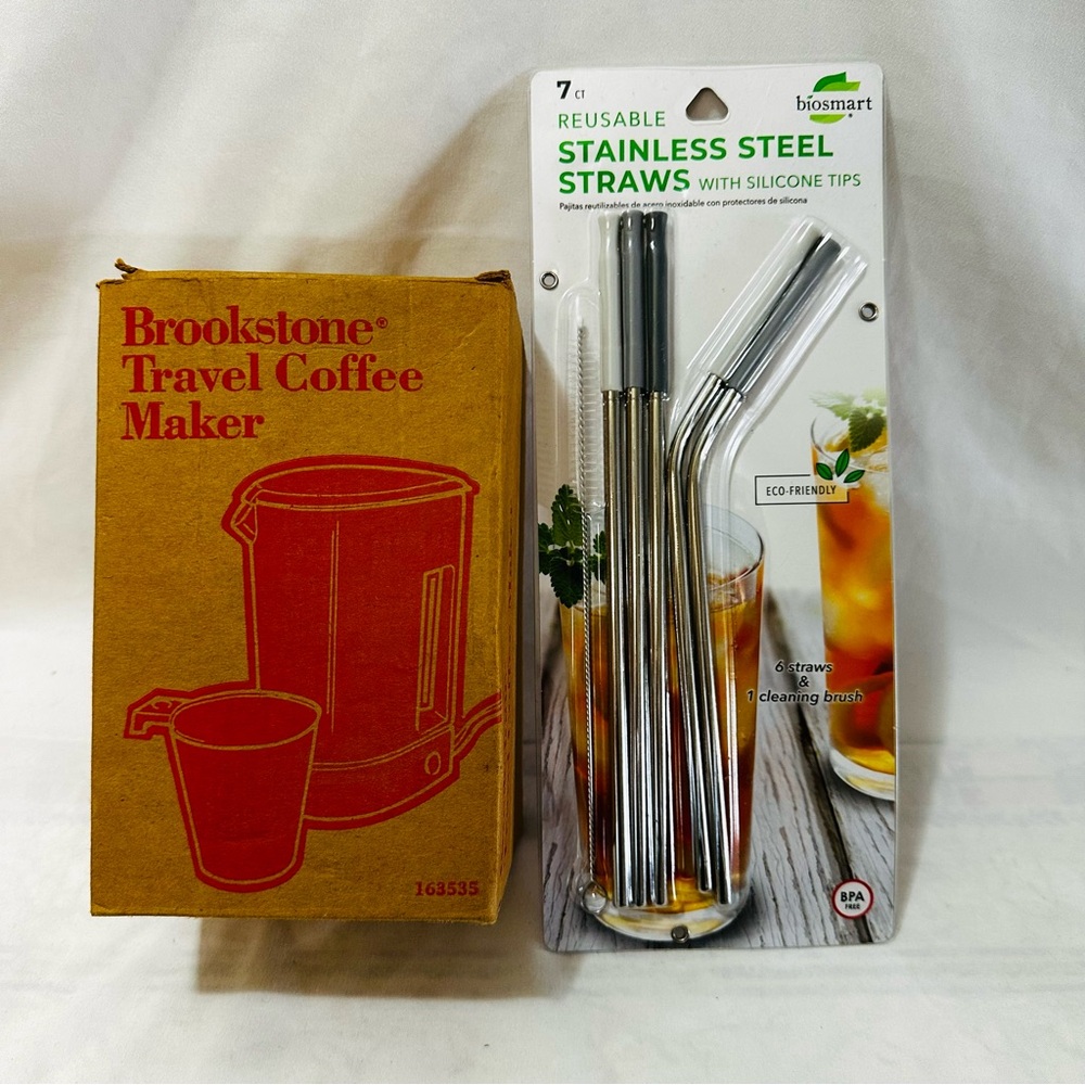 Brand new. Brookstone Red Travel Coffee Maker with Stainless Steel Straws